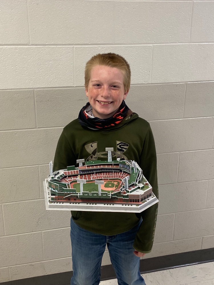 Student holding model