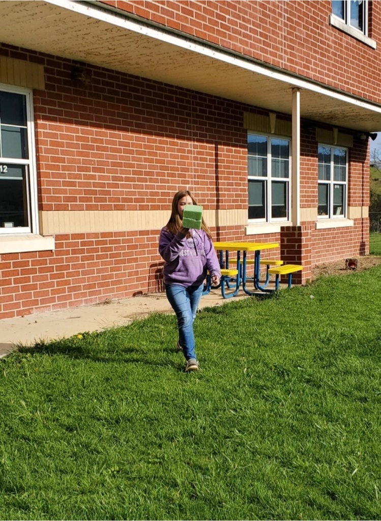 Student picking up egg project 