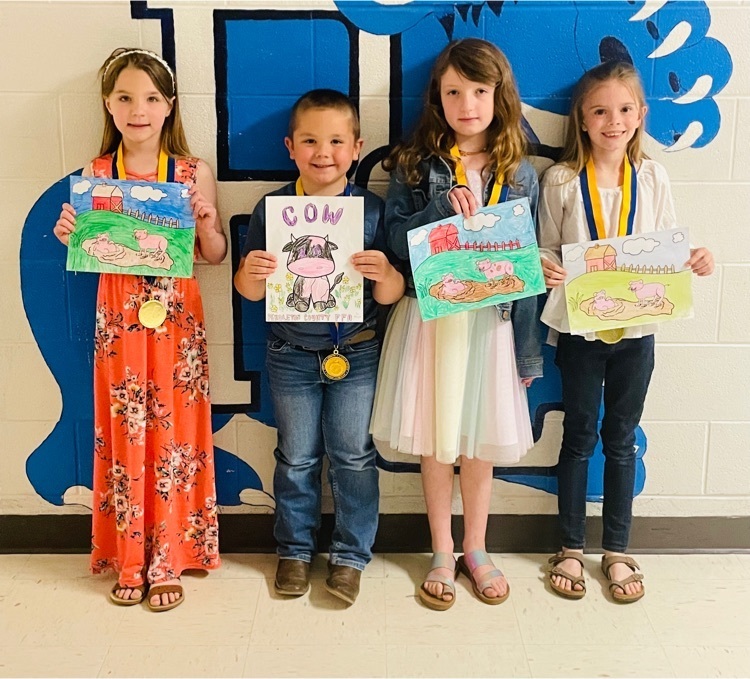 Students holding coloring picture