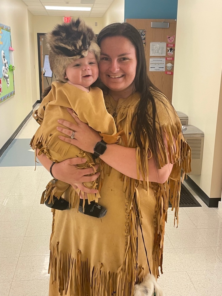 teacher and baby dressed as Native Americans 